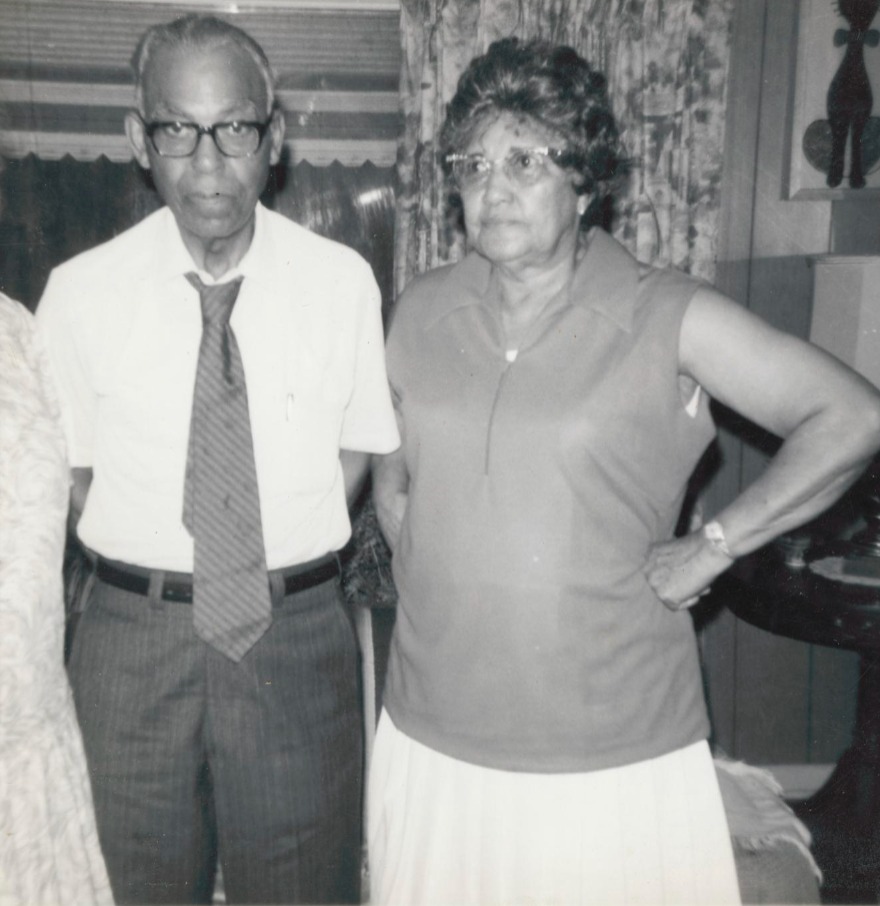 Eunice Jackson and her brother John Cloman Jr. standing together inside a home